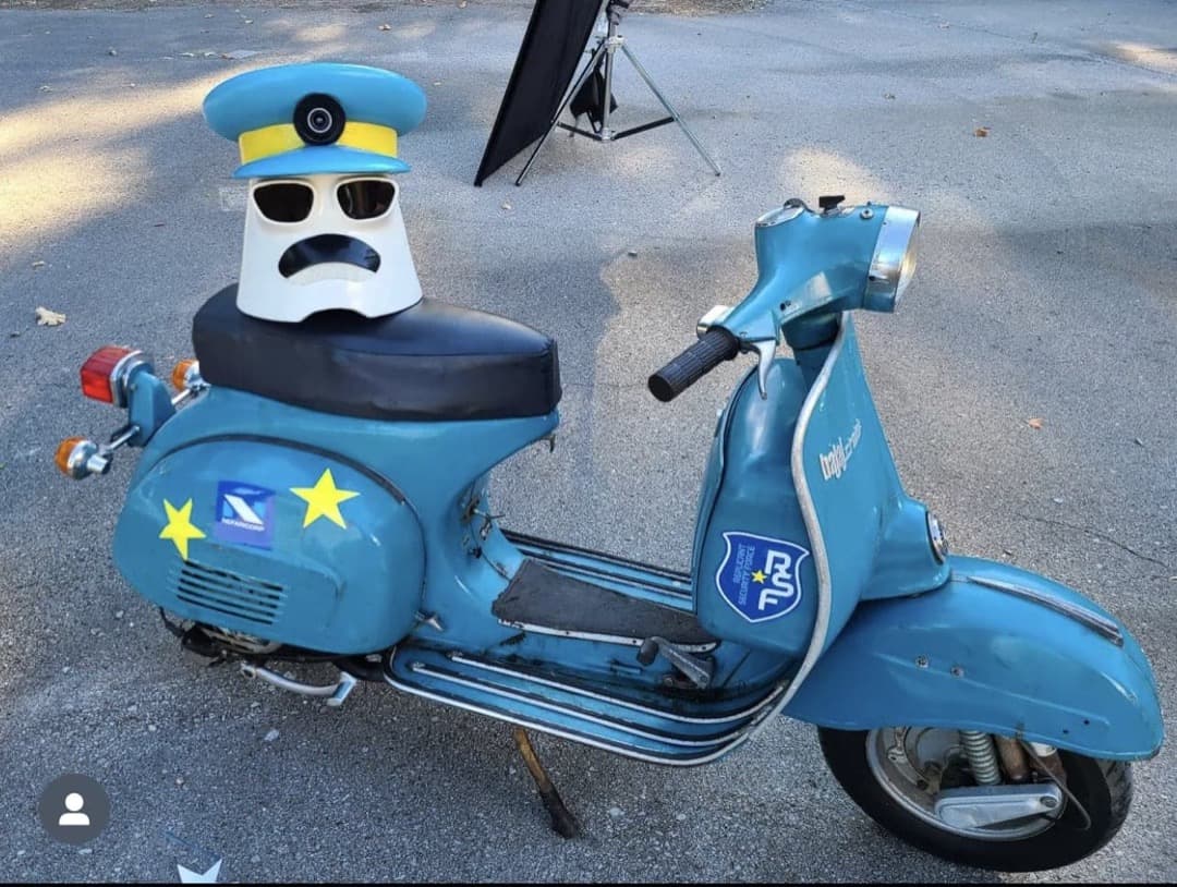 Behind the scenes photo 13 from Clone Cops production showing the replicant security force moped with clone cops helmet
